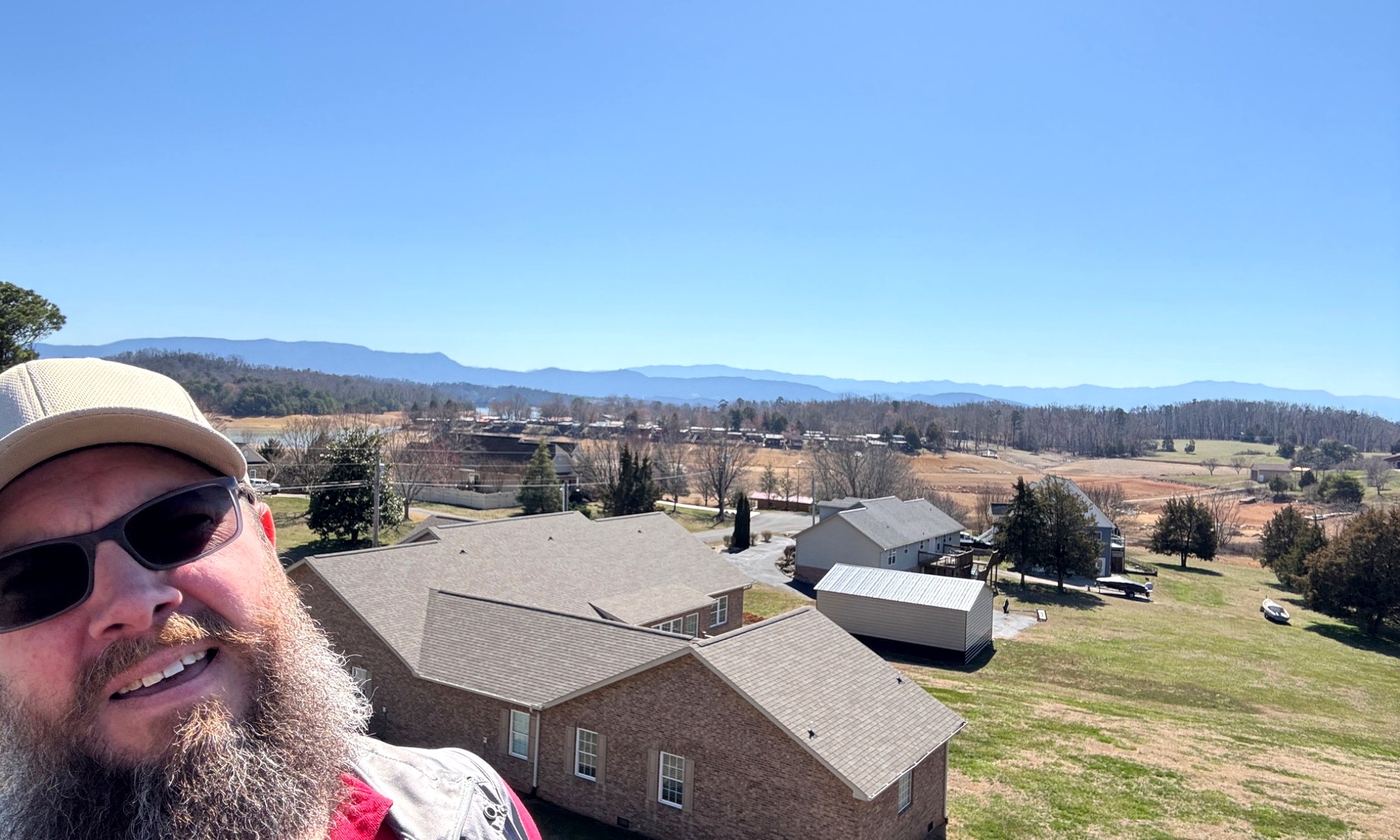 Neighborhood rooftops with mountain backdrop in Bristol, Tennessee